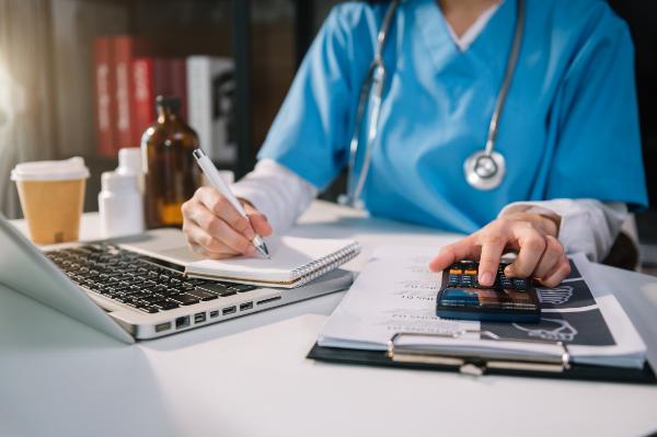 doctor adding up medical bills in a florida hospital